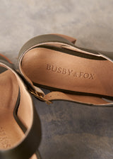Khaki green leather sandal with wooden heel and buckle detail