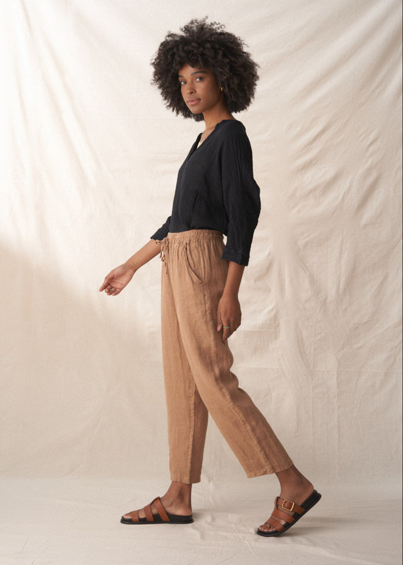 camel coloured straight linen trousers