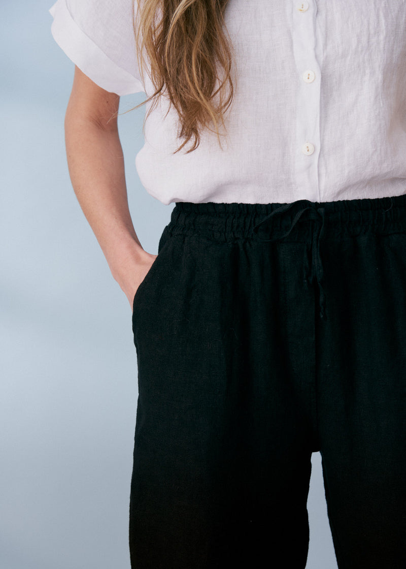 Black tapered linen trousers