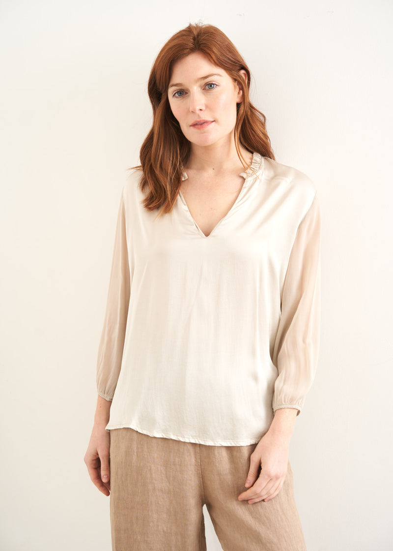 Soft cream blouse with frill trim collar