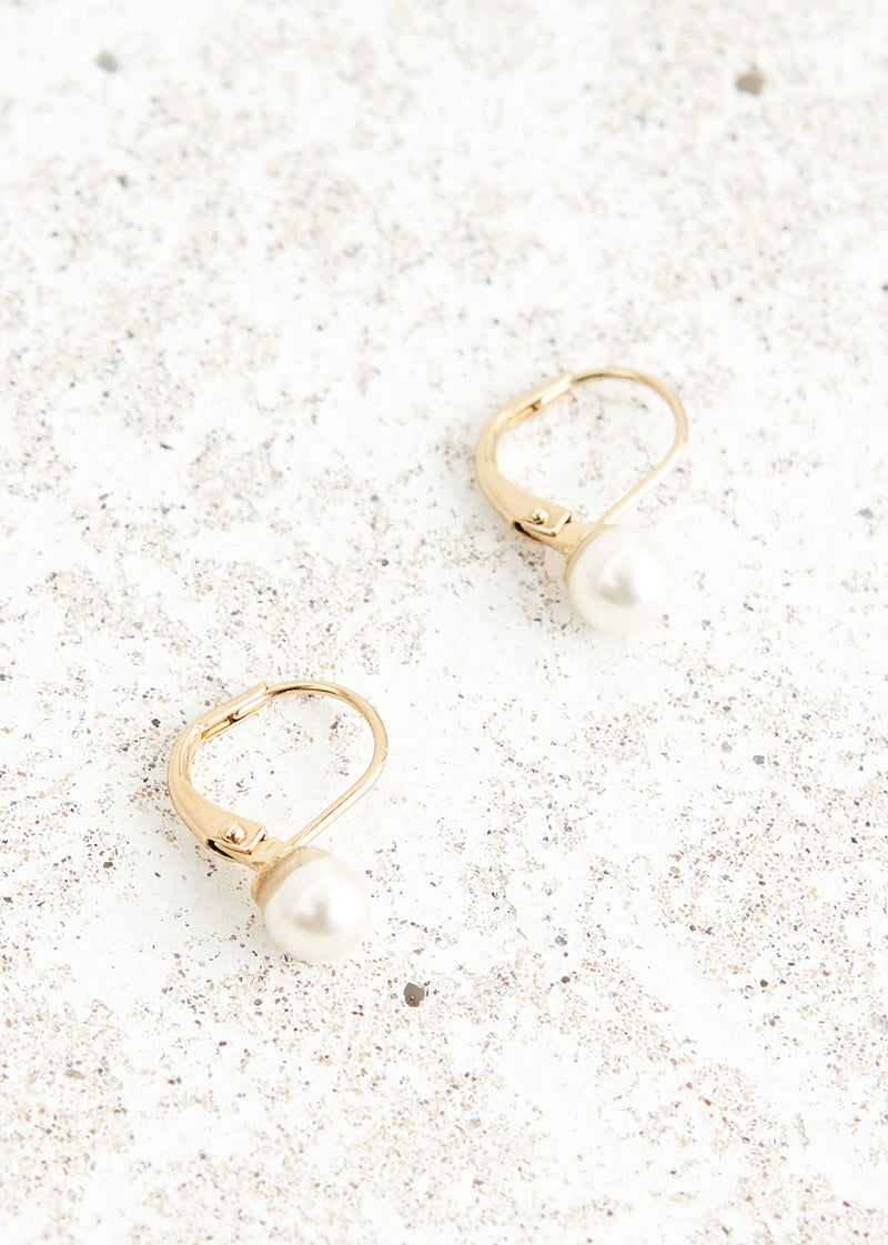 Gold hoop earrings with white pearl