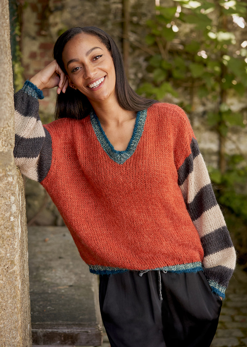 Red sweater with stripe and metallic detail