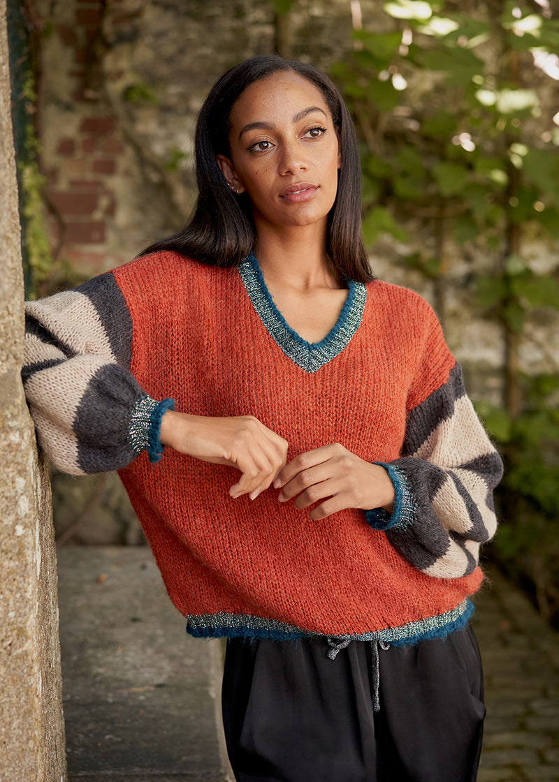 Red sweater with stripe and metallic detail