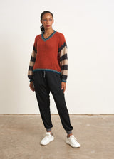 Red sweater with stripe and metallic detail
