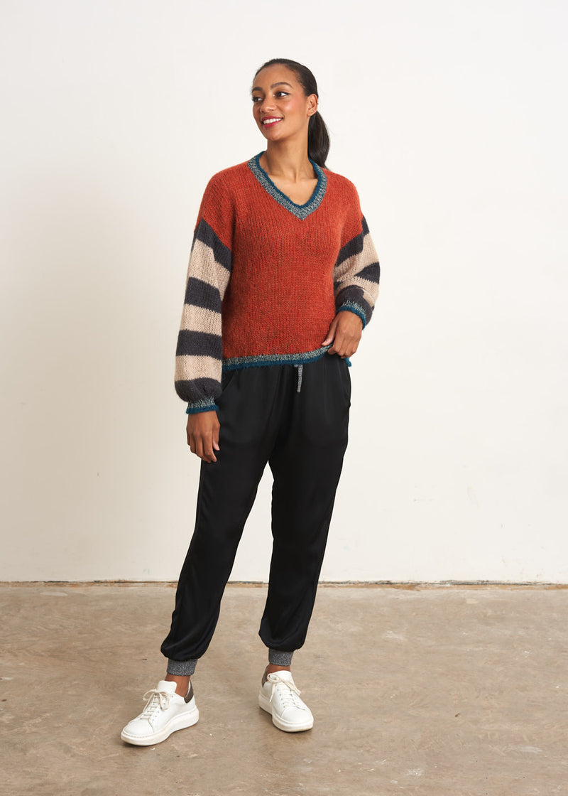Red sweater with stripe and metallic detail