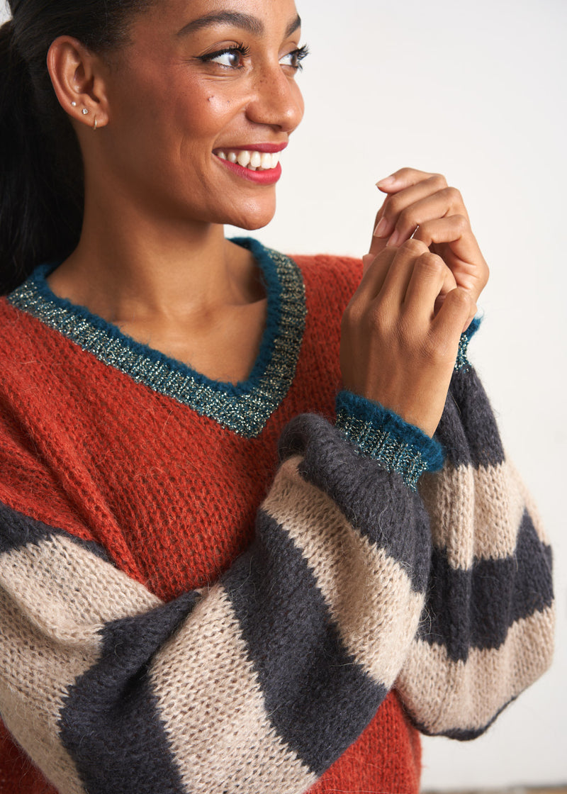 Red sweater with stripe and metallic detail