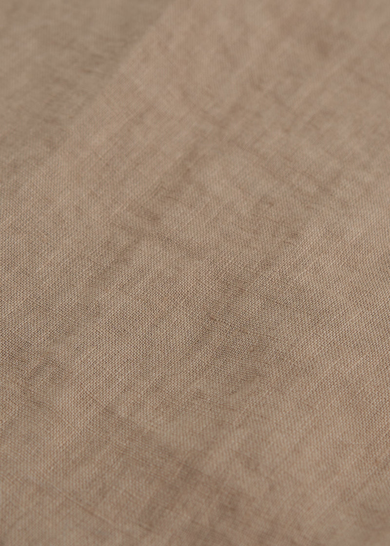 A close up of the texture of the linen