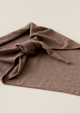A folded brown knit scarf or bandana tied in a loose knot, displayed on a light beige background.