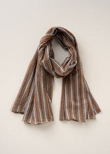 Striped scarf with brown, white, and orange pattern on a light beige background