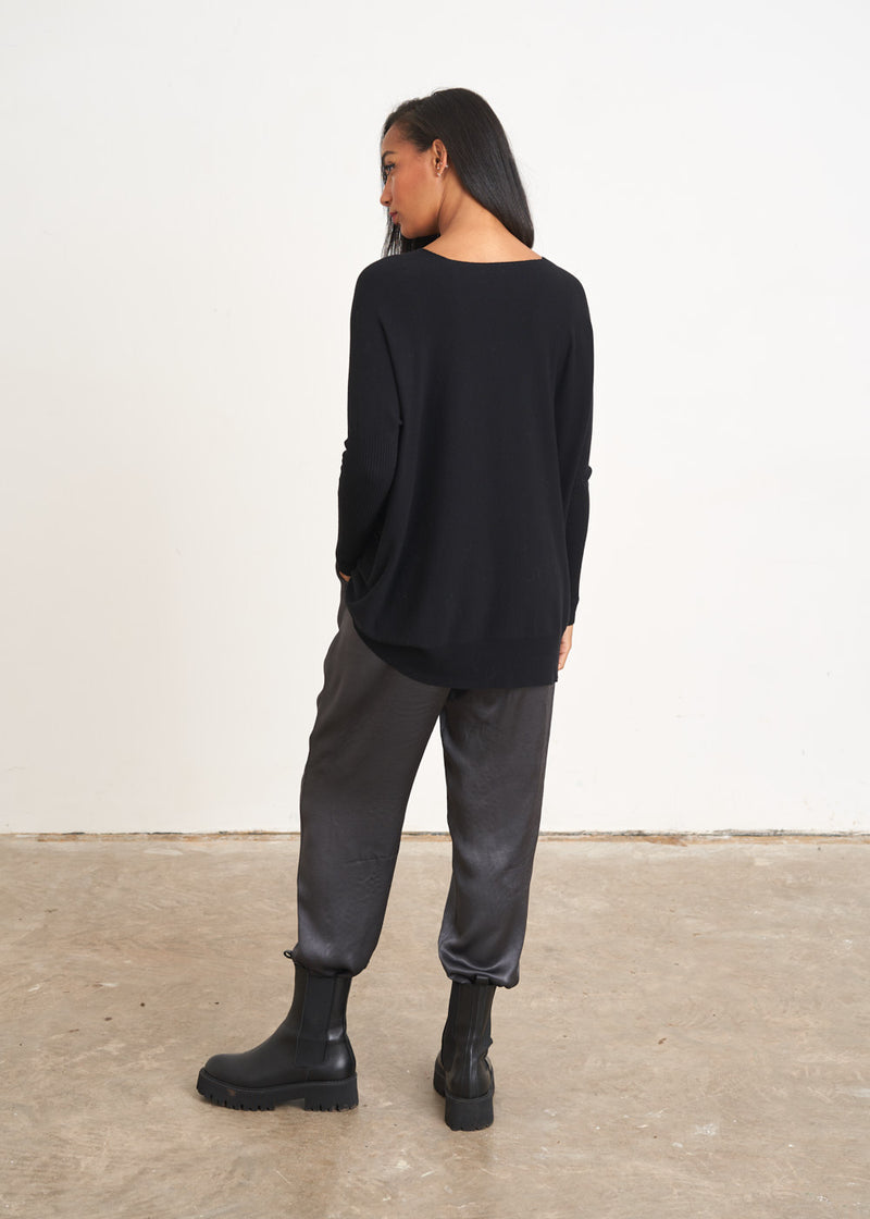 Black v-neck draped sweater