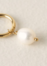 Gold hoop earrings with pearl drops