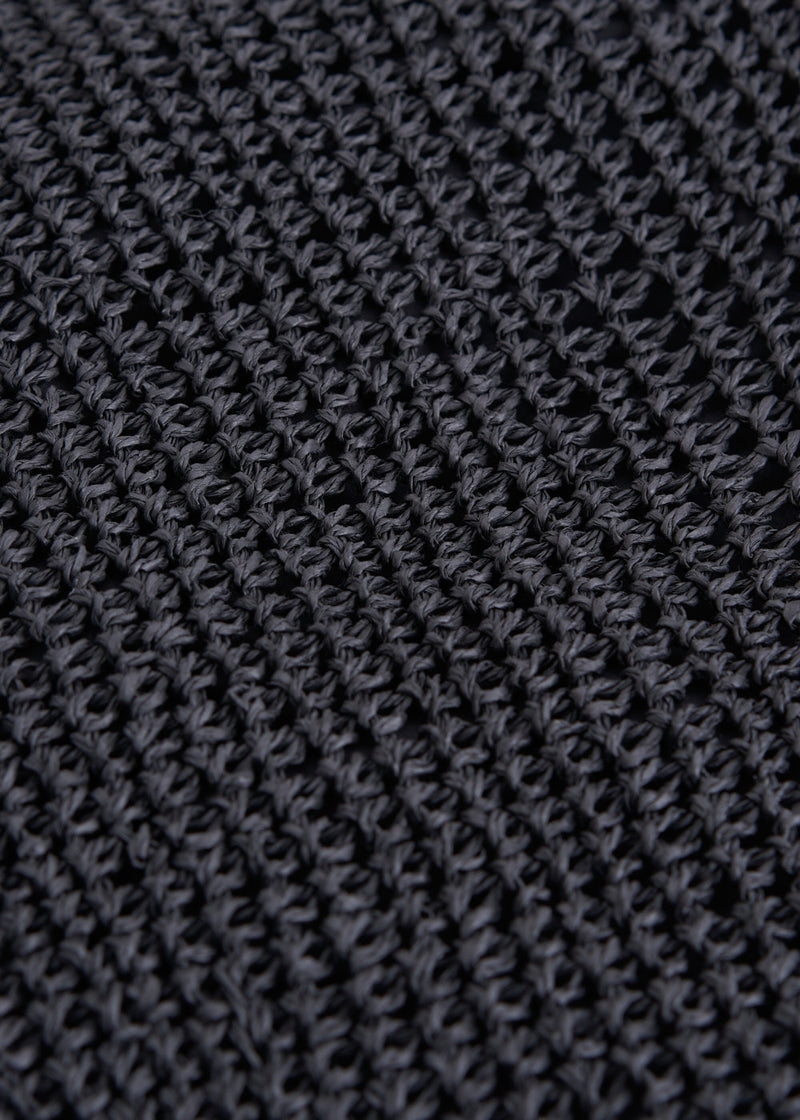 A black tote shopper bag made from crochet raffia