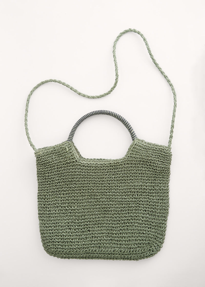 A green tote shopper bag made from crochet raffia