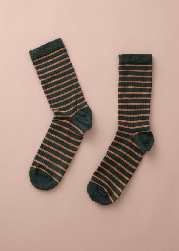 Pair of striped socks on a beige background