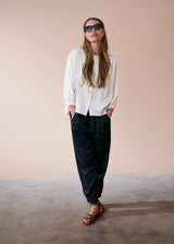 Off white satin top with crochet detail