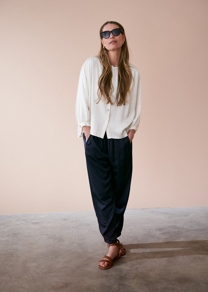 Off white satin top with crochet detail