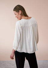 Off white satin top with crochet detail