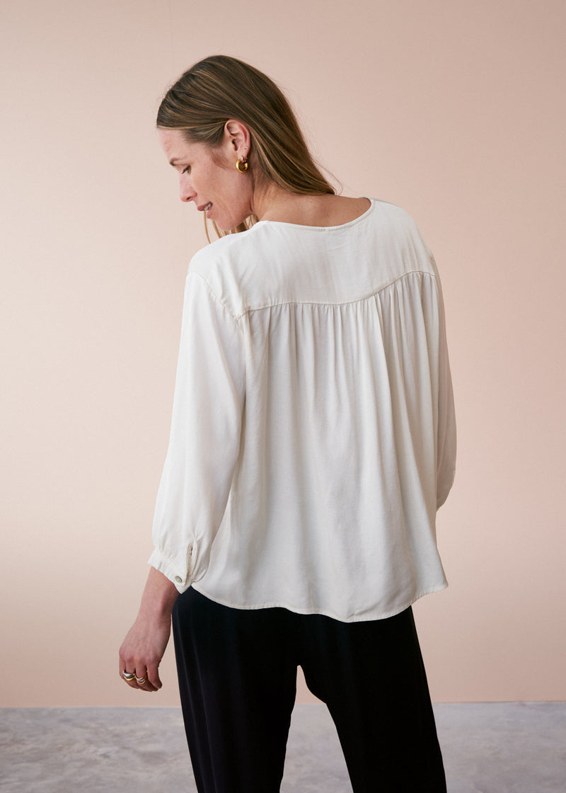 Off white satin top with crochet detail