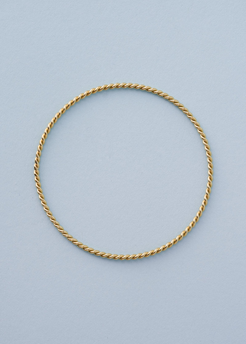 Gold twisted bangle