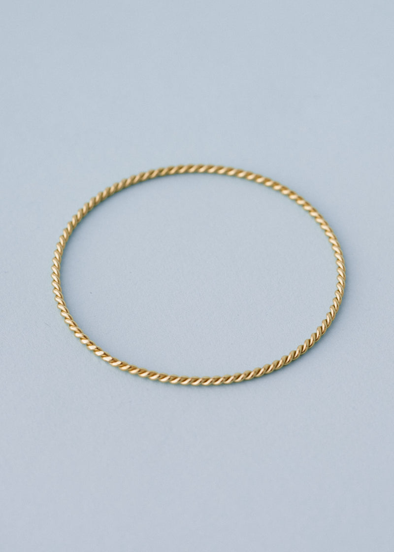 Gold twisted bangle