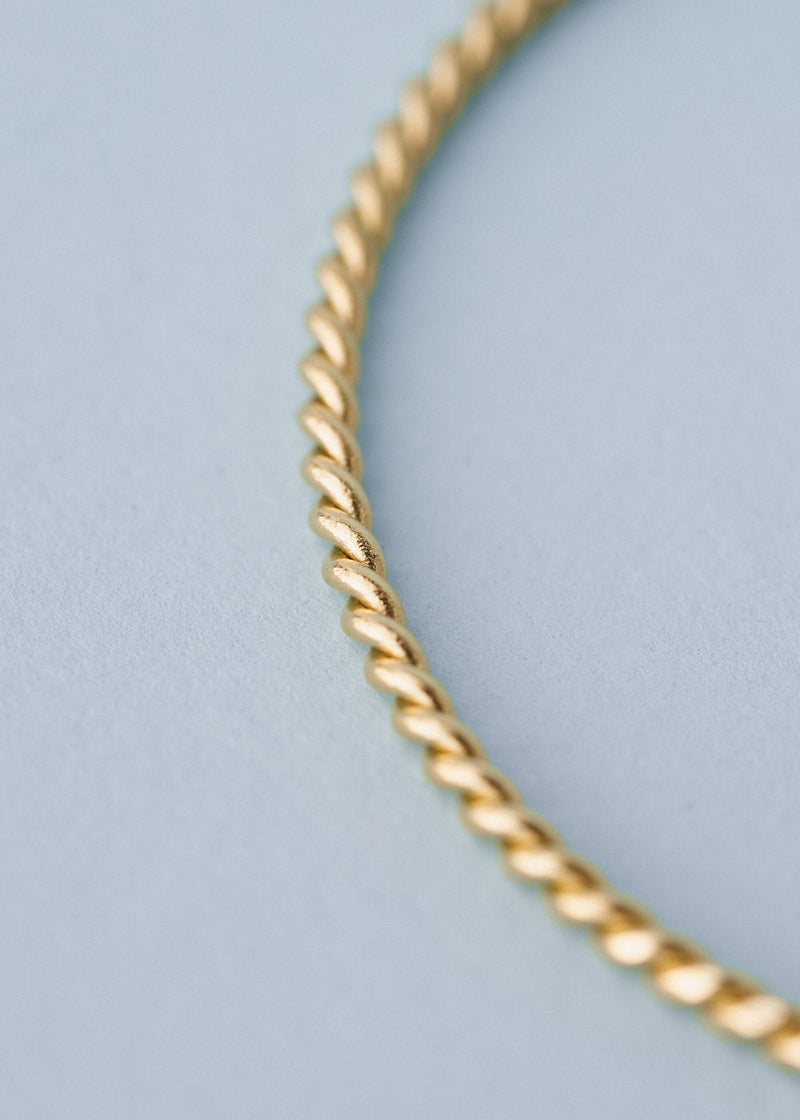 Gold twisted bangle