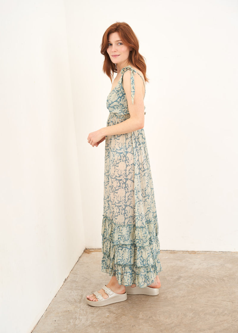 A model wearing a Pale blue ditsy floral strappy sundress