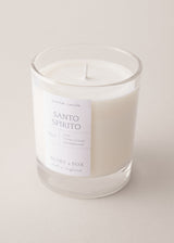 Santo Spirito candle in a glass jar with a white label on a light background