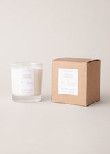 Candle and its packaging on a light background