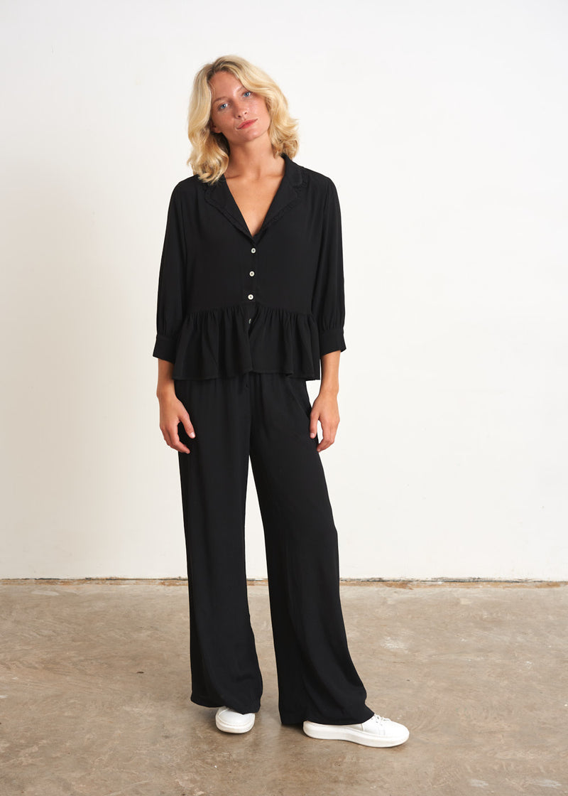 Black peplum top with buttons