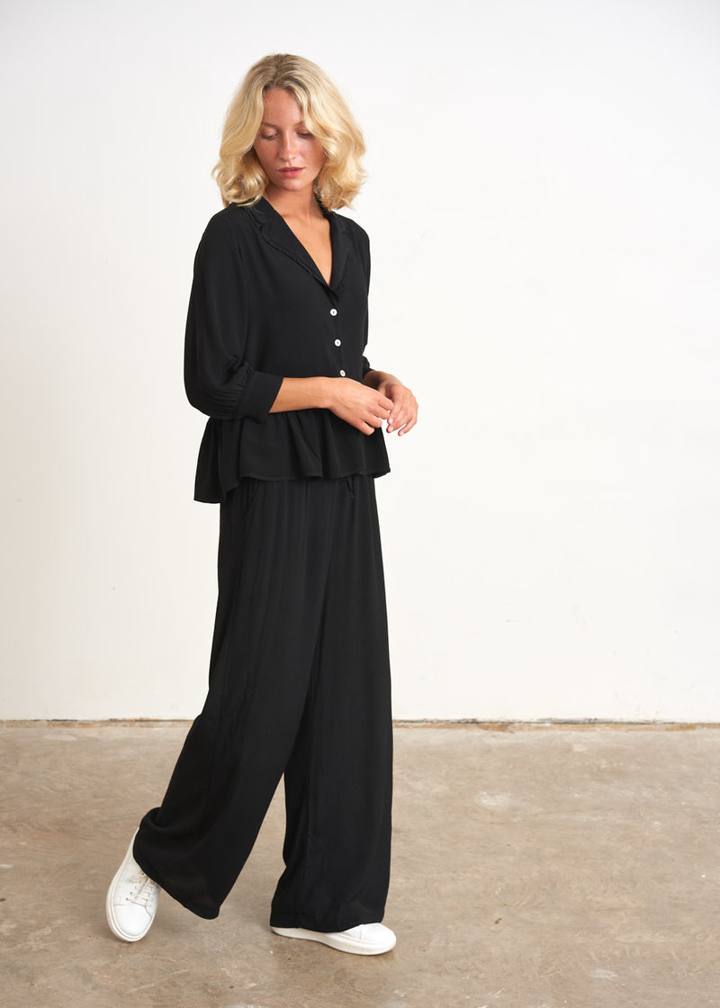 Black peplum top with buttons