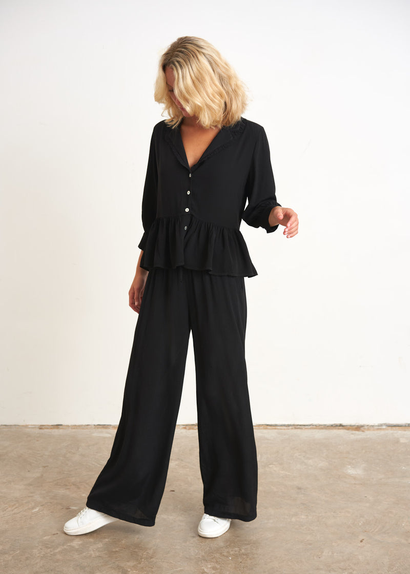 Black peplum top with buttons