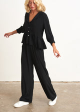 Black peplum top with buttons