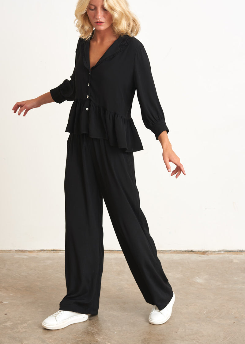 Black peplum top with buttons
