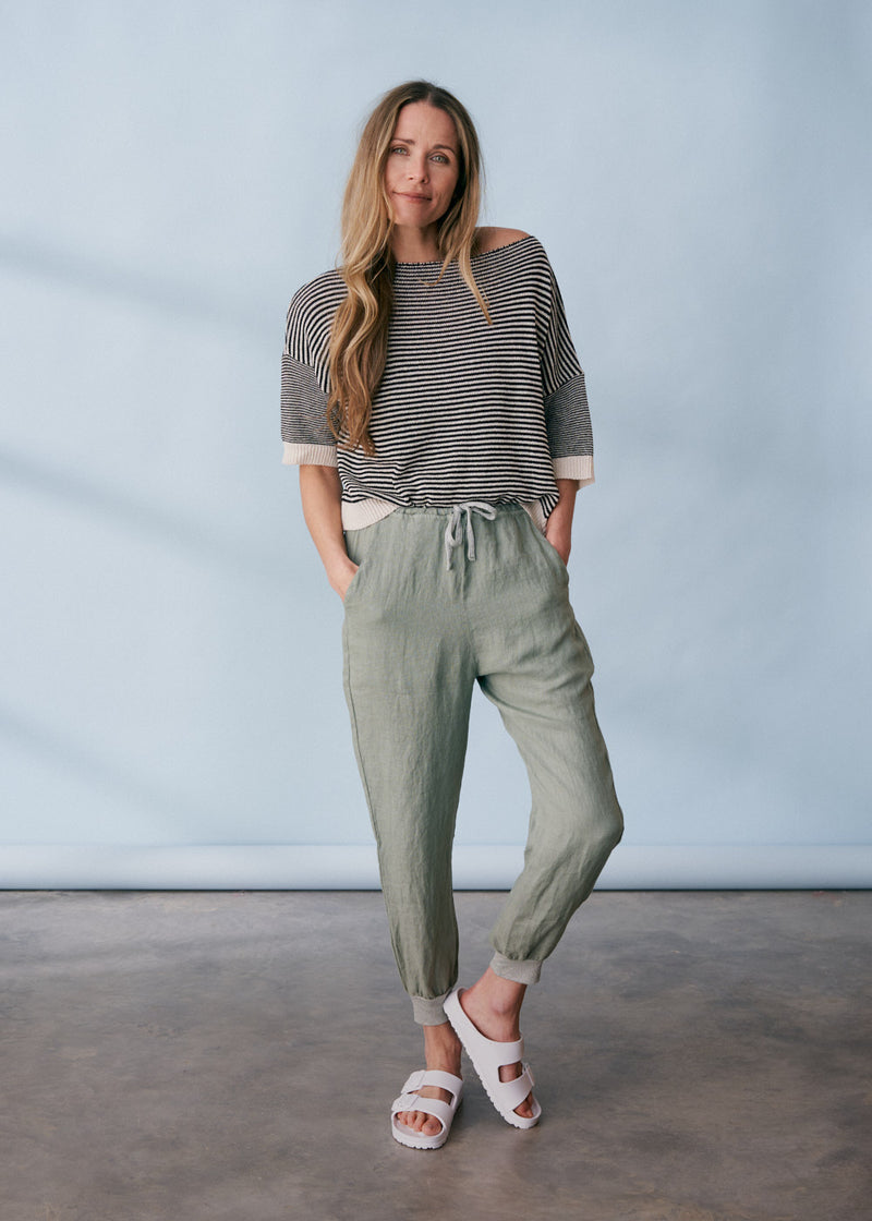 Sage green linen trousers with metallic trim