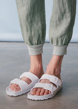 Sage green linen trousers with metallic trim