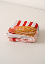 White waffle beach towel with red stripe pattern