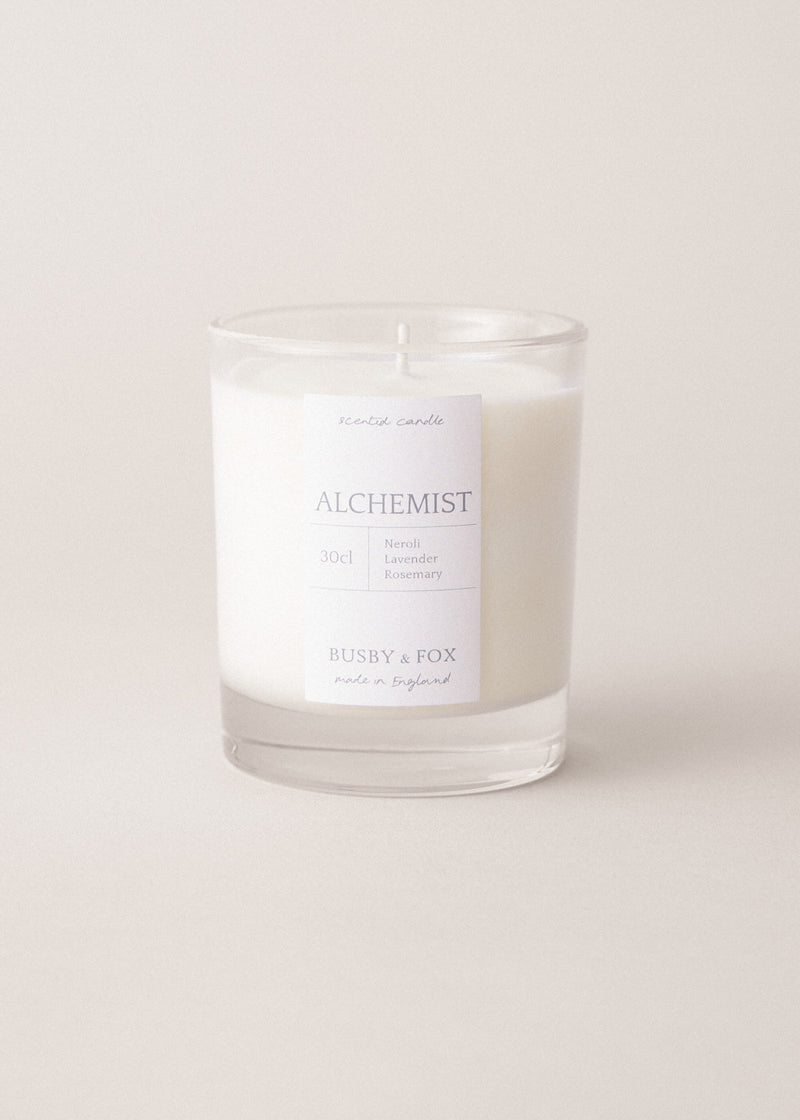 Alchemist candle with a scents of neroli, lavender and rosemary on a beige background
