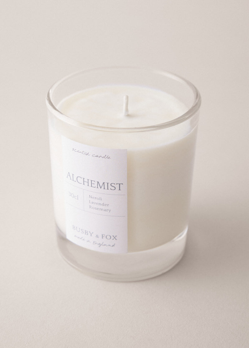Alchemist candle with neroli, lavender and rosemary on a beige background