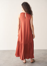 Woman wearing terracotta satin sleeveless midi dress