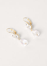 Side view of clear crystal drop earrings on white background