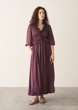 Woman wearing plum satin dress