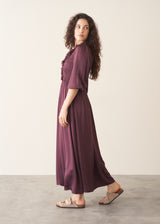 Woman wearing plum satin dress