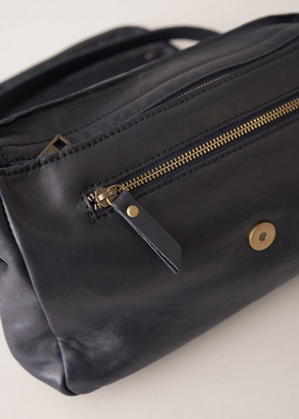 Black leather bag with gold stud detail