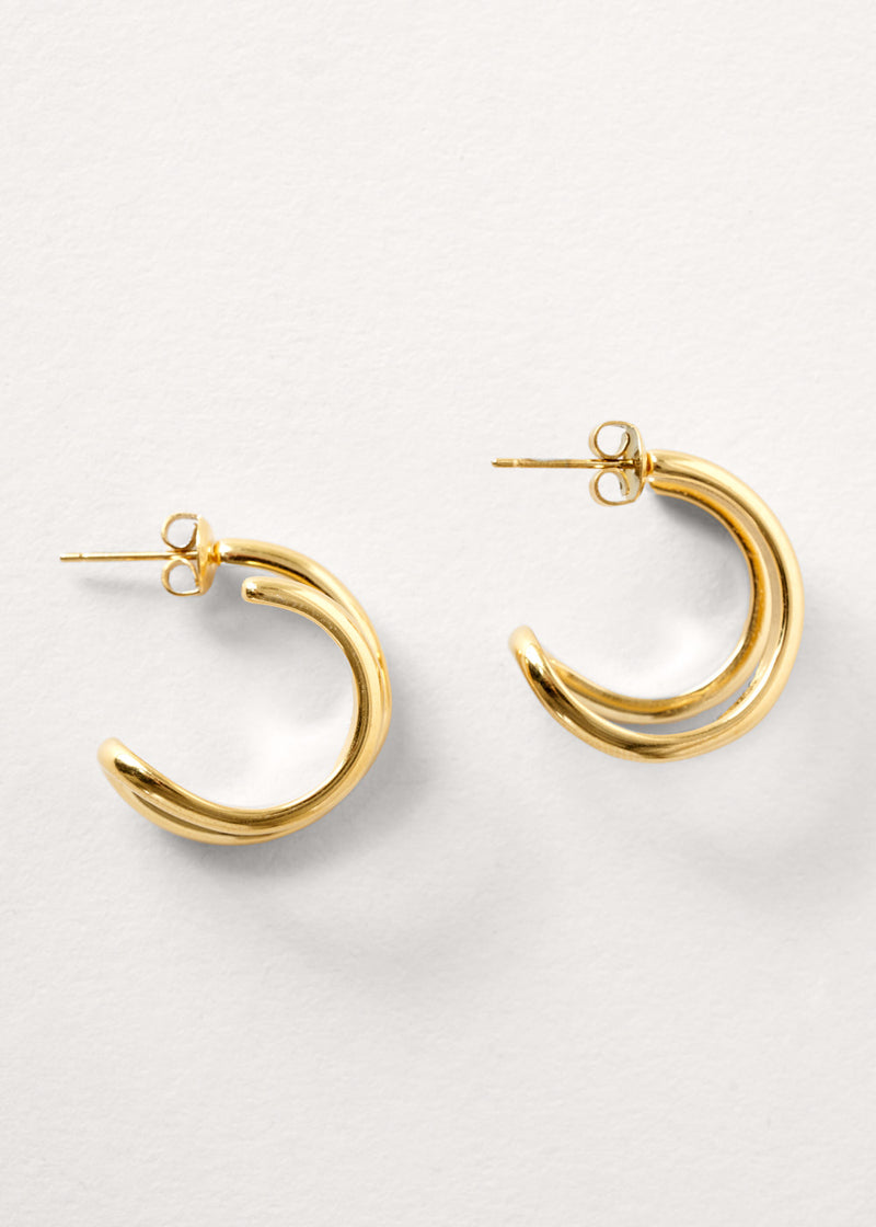 Gold double hoop earrings on white background