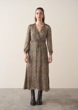 Woman wearing a leopard print wrap dress 