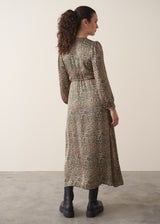 Woman wearing a leopard print wrap dress 