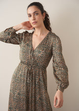 Woman wearing a leopard print wrap dress 