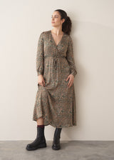 Woman wearing a leopard print wrap dress 