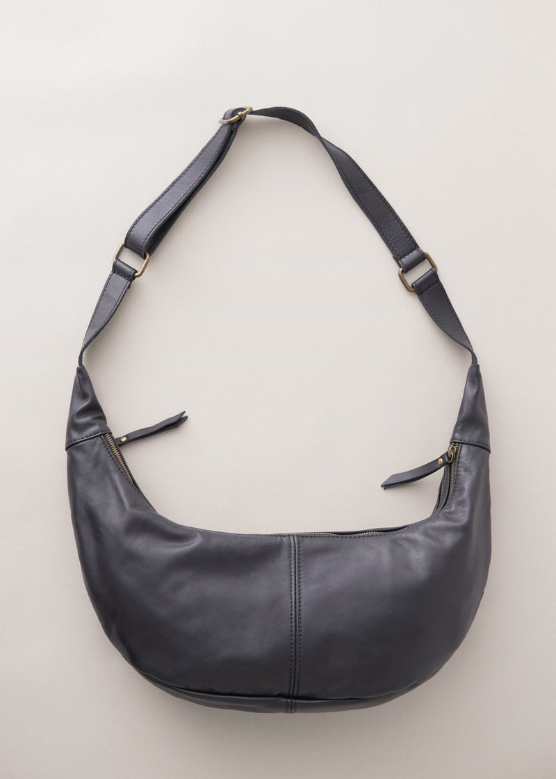 Black leather sling banana bag with zip fastening