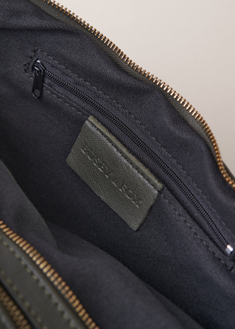 Khaki green leather sling banana bag with zip fastening